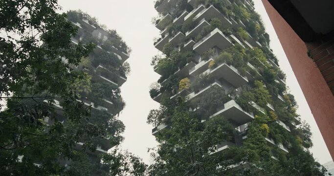 Green House Bosco Verticale in Milan - Ecological Apartment Building in Rainy Weather Cityscape. High quality 4k footage