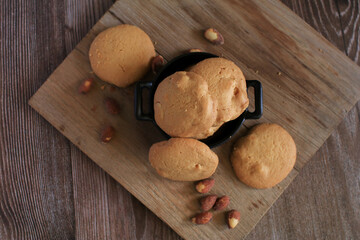 Homemade cookie almond on wooden cutting board. Healthy food. Oatmeal biscuits. Vegan vegetarian...