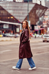 Obraz premium A Casual Girl Poses with Confidence and Style on Urban Streets