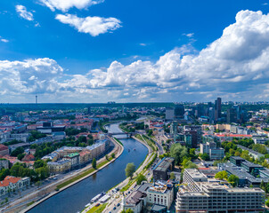 Fototapeta premium Vilnius, Lithuania. Aerial view of new city center with skyscrapers. Panoramic drone photo
