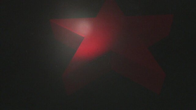 3D five-pointed star, red, passing through a thick, dirty atmosphere, smooth 3D revolving motion, dramatic light, realistic look and feel, front view, close-up slow-motion CG animation.