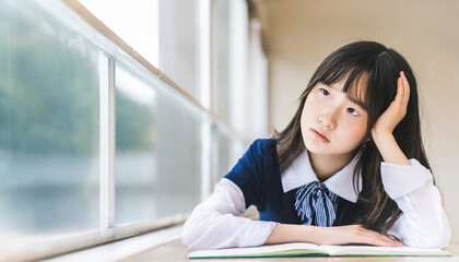 Teenage oriental schoolgirl with a bored expression on her head.