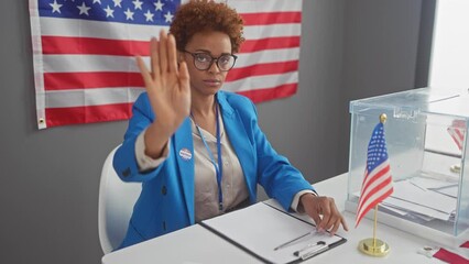 Confident african american woman government candidate gestures stop sign, a serious defense at electoral college