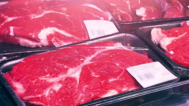 Freshly Sliced Beef Chuck Steaks: Lean and Juicy Portioned Cuts Chilled and Ready for Purchase at the Grocery Store