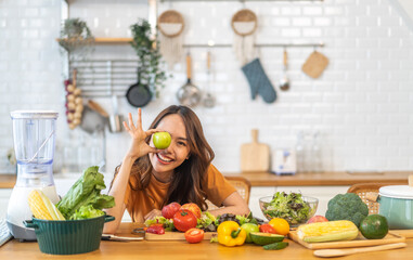 Portrait of beauty body slim healthy asian woman big smile cooking and preparing vegan food healthy holding apple, green apple, dental, teeth, fruit in kitchen at home.Diet.Fitness, healthy food