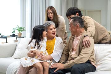 Portrait of happy love family asian father and mother playing with adorable asian kid girl.daughter, care, insurance.Happy family moments good time love with grandparents.Love of big family