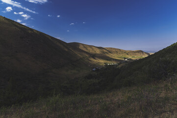 View from the top of the village in the valley in the mountains in summer