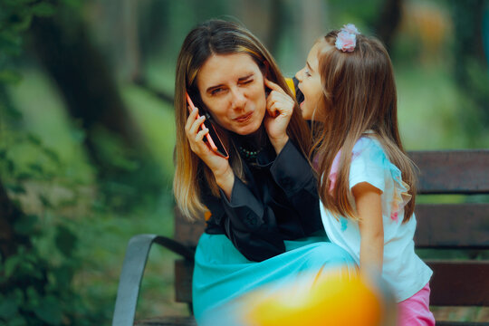 Child Yelling While Mom Tries to Speak on the Phone. Little kid interrupting her mother while trying to have a conversation

