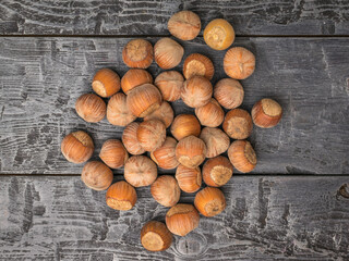 Healthy Raw Hazelnuts on Rustic Wooden Background - Nutritious Snack, Autumn Flavor, Culinary Ingredient