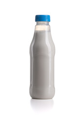 Plastic milk bottle with blue lid isolated on a white background.