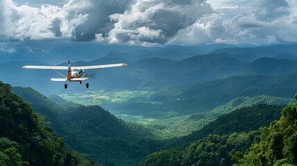 Small Personal Plane Soaring Over Lush Tropical Mountainous Landscape