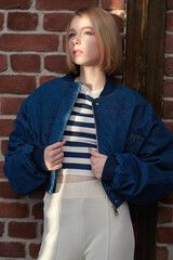 teen girl in denim bomber