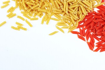 Macaroni red and yellow, on a white table, free space, place for text, top view, background