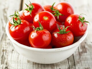 Fresh red tomatoes in a white bowl