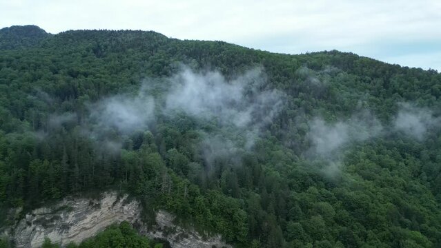 Smoke Clouds Over Woodland Mountain Near Lepsa, Vrancea County, Romania. Aerial Shot