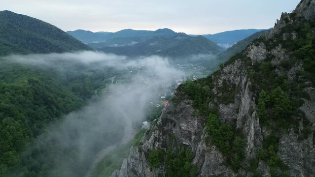 Floating Misty Clouds Over Mountainscape And Villages In Lepsa, Vrancea County, Romania. Aerial Shot