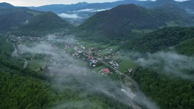 Rural Town Down Forested Valleys During Foggy Sunrise In Lepsa, Vrancea County, Romania. Aerial Shot