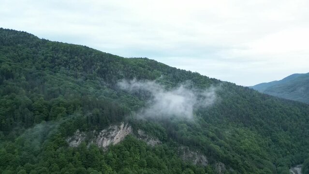 Wooded Mountainscape And Clouds Over Hike Trails Near Lepsa, Vrancea County, Romania. Aerial Shot