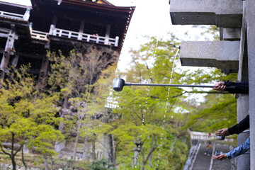 Water from the Otowa waterfall. Kiyomizu-dera temple in Kyoto, Japan