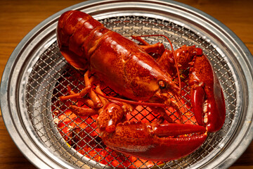 Lobster grilled on hot charcoal grill  ready to eat,Grilled Canadian lobster. 