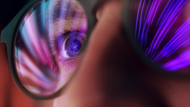 Eyes of Adult Man in Glasses Looking at Cyber Space on Computer Screen Close Up. Online Addiction of One Person in AR Eyewear with Artificial Intelligence. Eyeballs of Guy Browsing Internet 3D Network