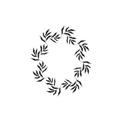 A black and white image of a wreath with leaves. The wreath is circular and has a lot of leaves