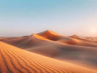 Golden sand dunes in a tranquil desert setting at sunset, highlighting the vastness and beauty of the natural landscape.