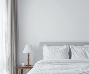 Modern hotel room with elegant bedding and stylish decor. Neutral tones and use of natural light.