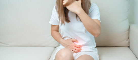 woman having abdomen ache due to Stomach pain, digestion with constipation or Diarrhea from food...
