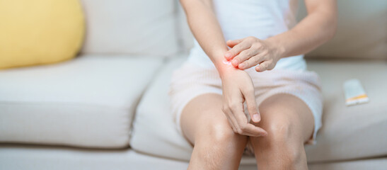 Arthritis and Muscle Pain Relief Cream concept. Woman having wrist pain at home, muscle ache due to...