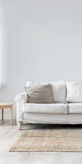 Bright minimalist living room in a luxury home with stylish minimal furniture and natural lighting. Home decor minimalist composition in neutral tonality.
