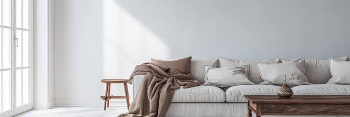 Bright minimalist living room in a luxury home with stylish minimal furniture and natural lighting. Home decor minimalist composition in neutral tonality.