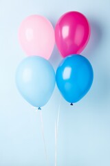 A bunch of balloons in pink, blue, and white. The balloons are floating in the air and are scattered all over the image. The balloons create a festive and joyful atmosphere