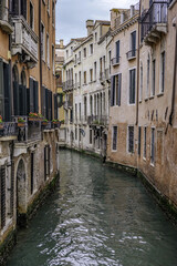 Venice, Italy - Typical Residential apartment homes and city life scene showing buildings and exteriors of typical Venetian architecture design.