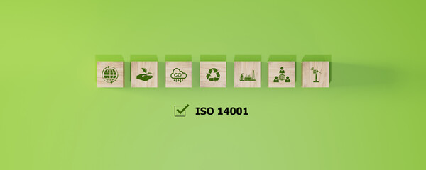 ISO 14001 concept. ISO 14001 environmental management icons on blocks against a backdrop, promoting...