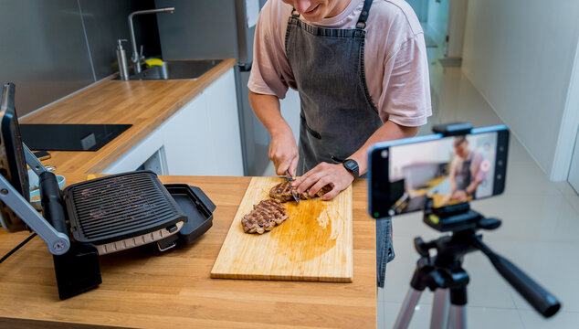 The chef is broadcasting live from workshop how to prepare a beef steaks on the electric grill