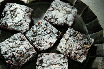 Chocolate brownies on a dark background
