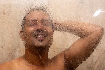 Fototapeta premium Refreshing Shower: Young Man Enjoying a Morning Bath.
