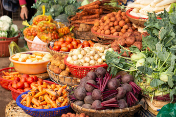 Fresh vegetables on display in a traditional market