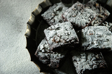 Chocolate brownies on a dark background	