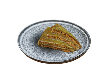 Moist pistachio cake, isolated on white background