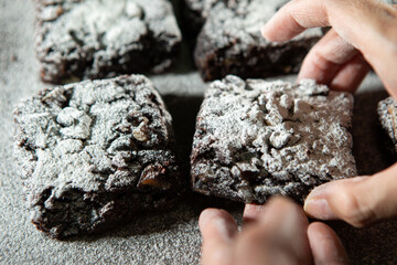 Chocolate brownies on a dark background	