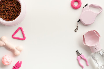 Collection of pet supplies, including various foods, toys, and grooming tools on a white background. Flat lay, top view, copy space.