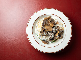 Fried button mushrooms with cheese on a plate