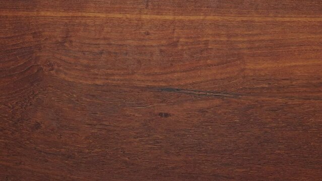 Teak wood tabletop background. Teak wood texture background. Horizontal shot of long teak wood tabletop. Empty tabletop.
