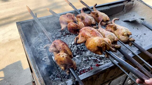 Crafting Balochi Chicken Sajji on Charcoal Grill. Culinary Artistry in Progress.