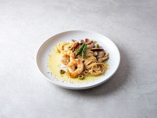 Oil pasta with mushrooms on a plate	