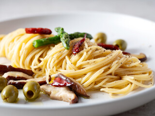Oil pasta with mushrooms on a plate