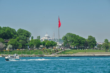 Istanbul. Boat on the Bosphorus. The Suleymaniye mosque is in the background.