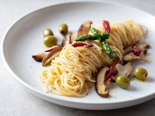 Oil pasta with mushrooms on a plate